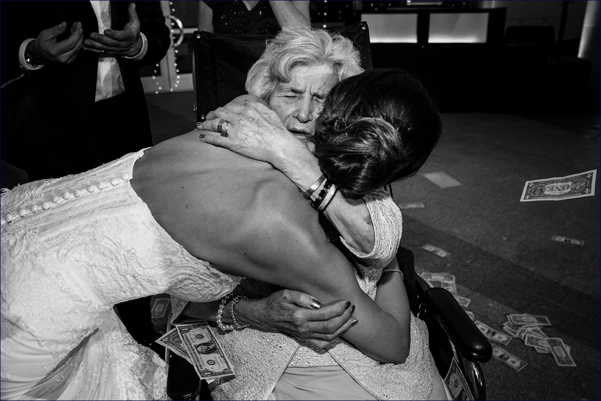The bride and her grandmother embrace on her wedding day
