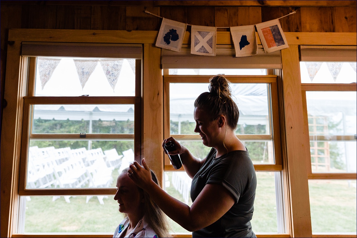 Trenton Maine Wedding Photographer Acadia Bar Harbor a bridesmaid gets her hair done on the morning of her friend's wedding