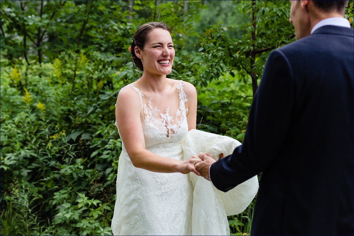 Bar Harbor bride laughs during her first look with the groom