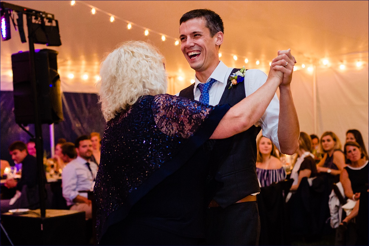 The groom dances with his mother at the wedding reception