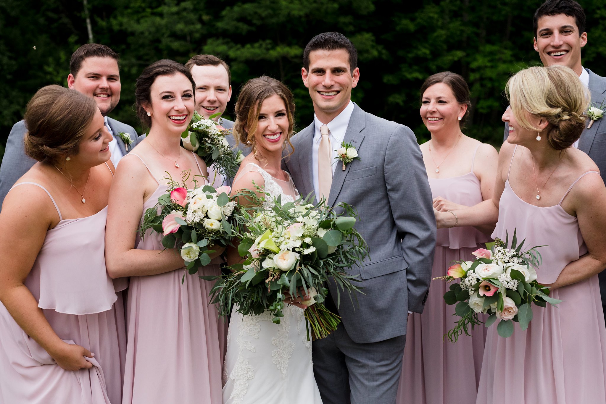 The Preserve at Chocorua New Hampshire Wedding with the wedding party enjoying a laugh together before the outdoor tented ceremony