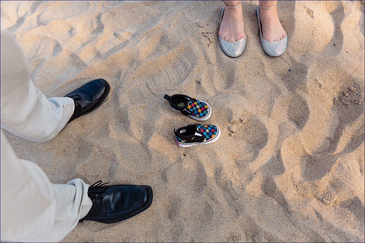 Three sets of shoes at the beach intimate ceremony