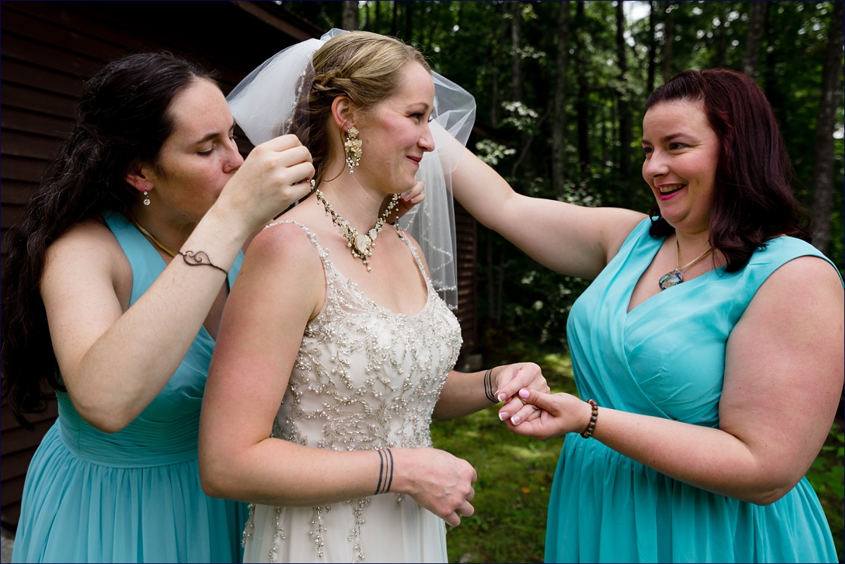 The bridesmaids all get the bride ready for her wedding day in Dublin New Hampshire