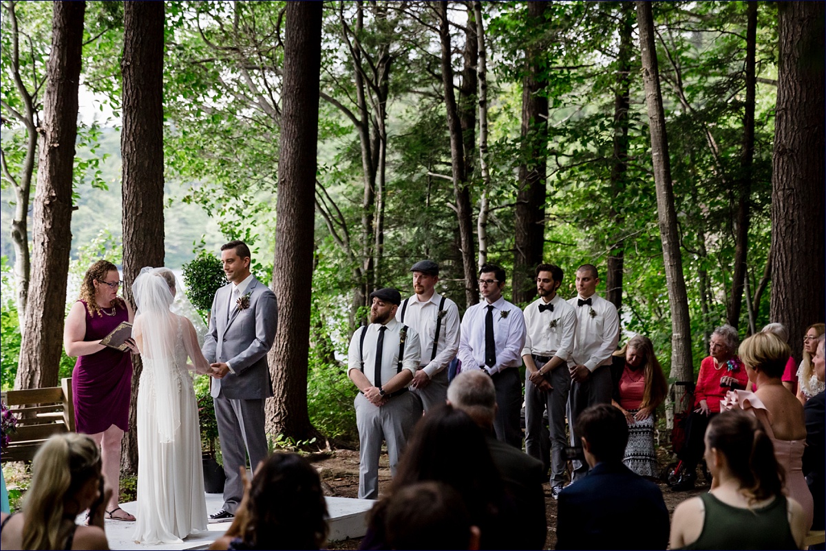 The groomsmen and groom during the camp ceremony deep in the woods