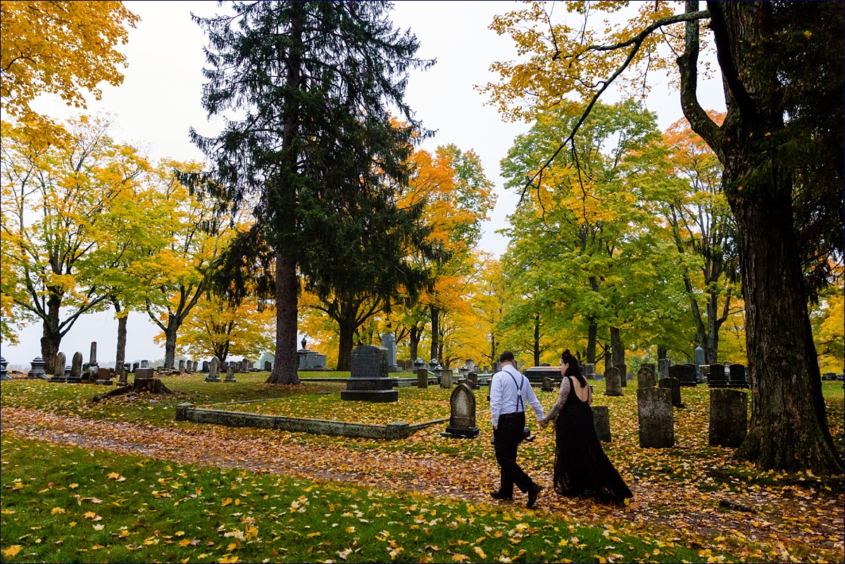 The newlyweds walk through the fall leaves after eloping