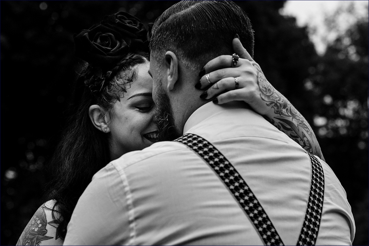 The bride's tattooed hands hold onto her husband after they eloped in Dover NH