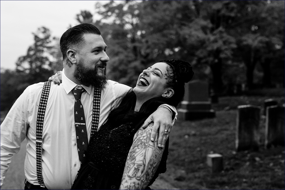 The bride laughs in the arms of her husband after their Dover NH elopement