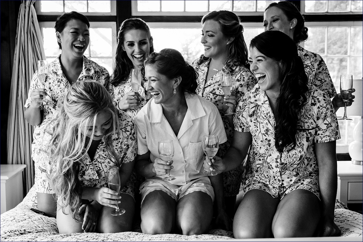 Linekin Bay Resort hosts the bride and her bridesmaids while they laugh toasting the bride's wedding day