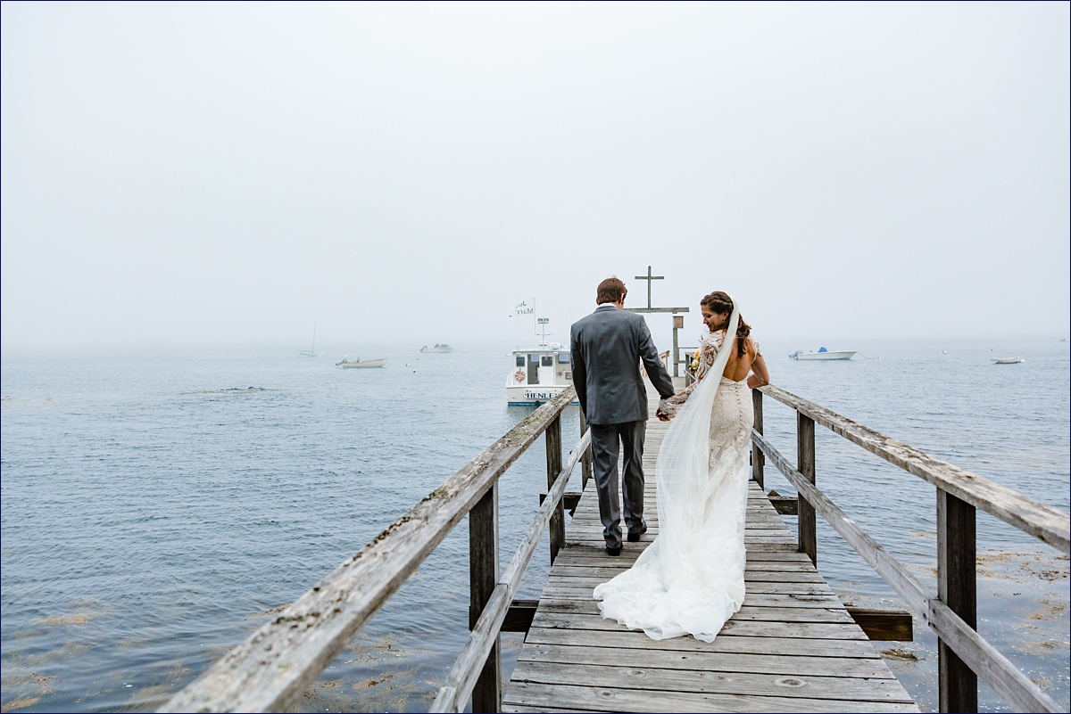 The bride and groom leave their ceremony at their All Saints by the Sea in Southport Maine wedding