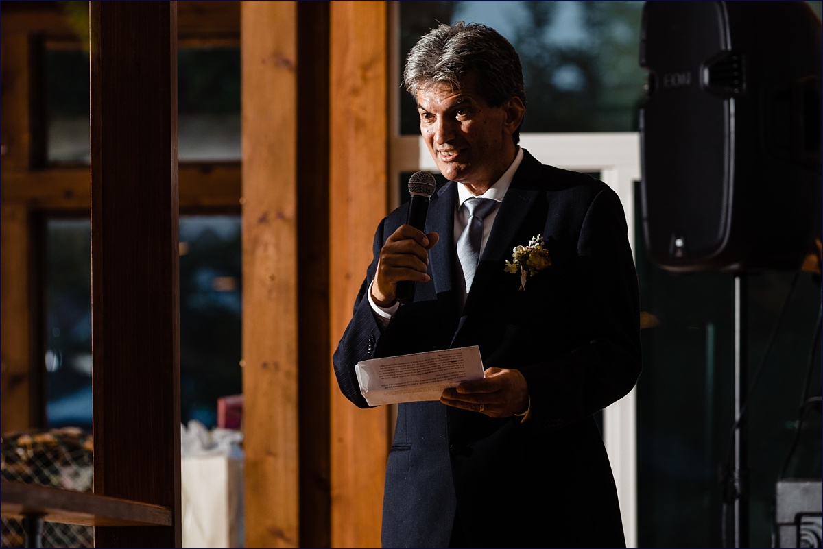 Father of the bride gives a toast at the wedding reception