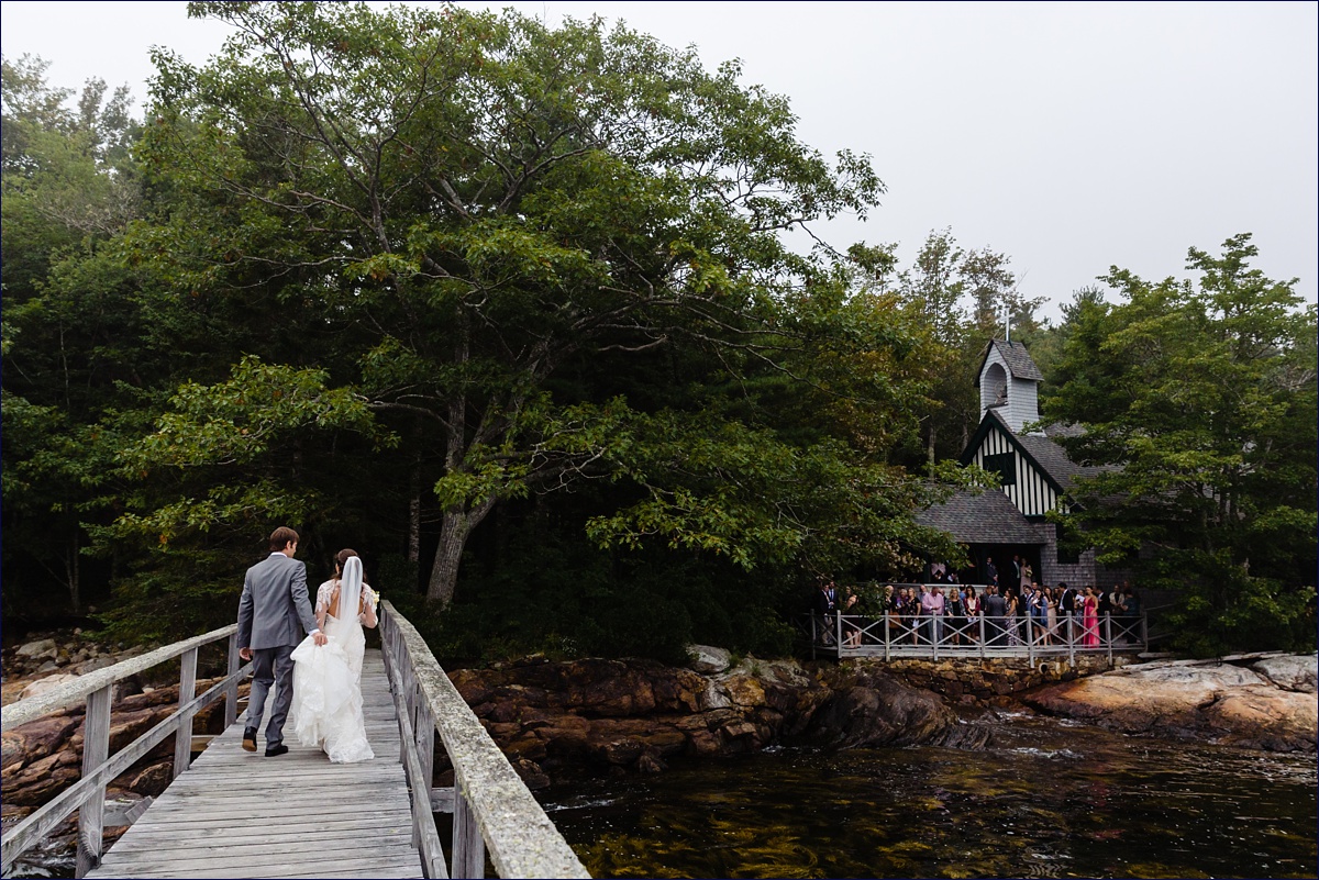 All Saints by the Sea in Southport Maine the bride and groom leave their ceremony