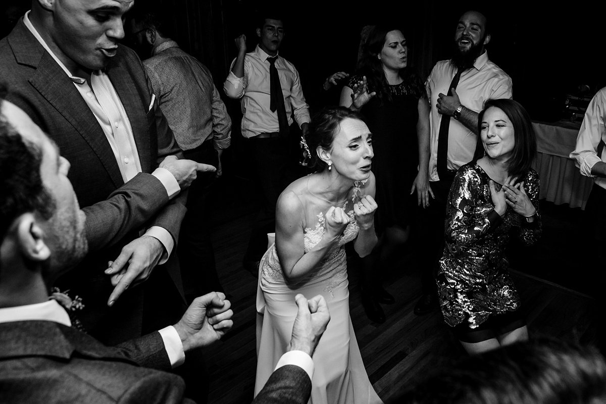 The bride gets into the music at her wedding reception on the Casco Bay Maine