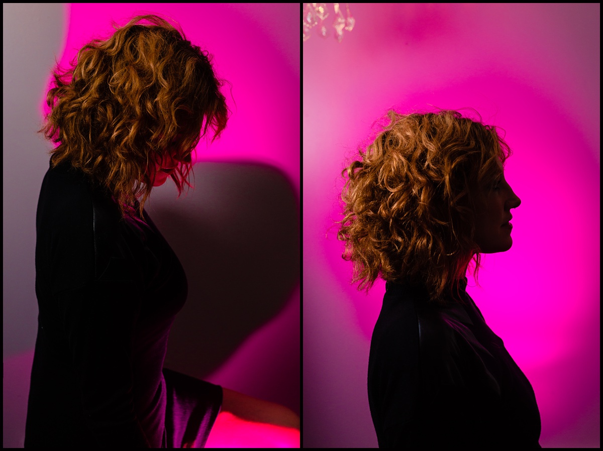 Natalee Miller stands out in silhouette in front a pink wall for her creative portraits for Amenti Oracle and Lust Cult