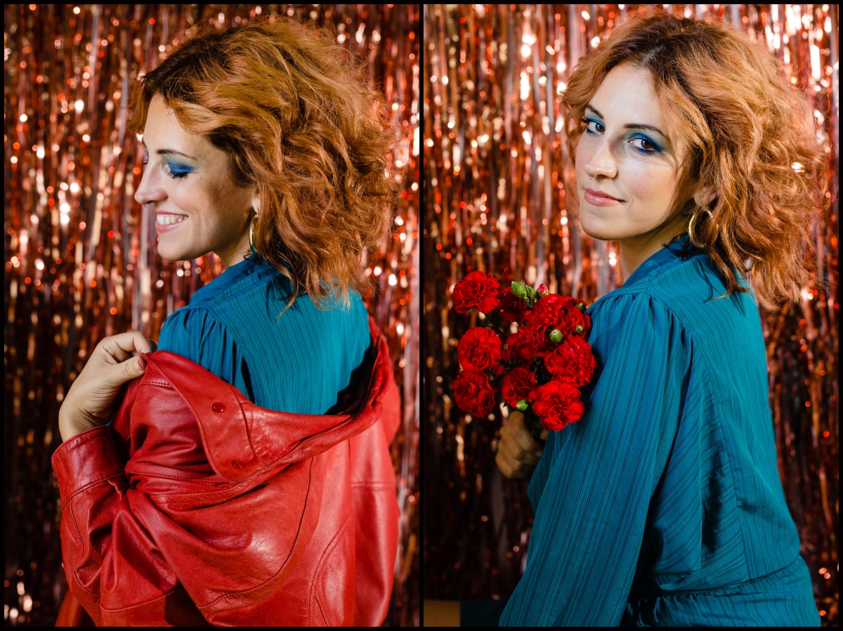 Natalee Miller poses with flowers and a bright red leather jacket in her 80's inspired portrait shoot for Amenti Oracle and Lust Cult businesses