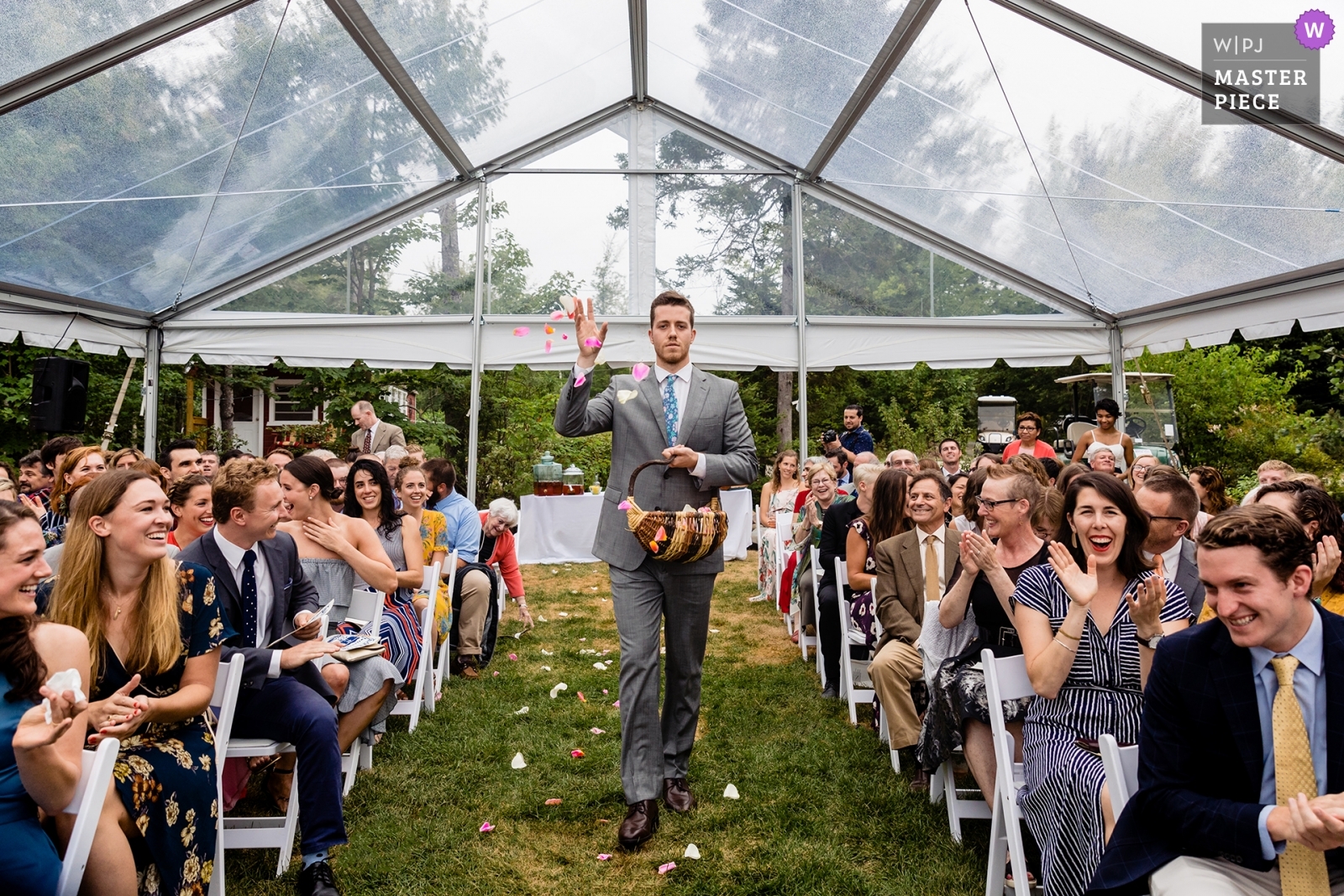 Award Winning New Hampshire Wedding Photographer my image from a Trenton Maine wedding where the flower MAN tossed petals down the aisle to the delight of the guests!