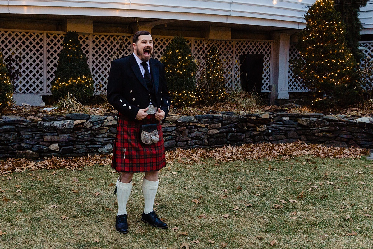 The groom has the best look of excitement as he is in his wedding day kilt and sees his bride come towards him in her gown in New Hampshire