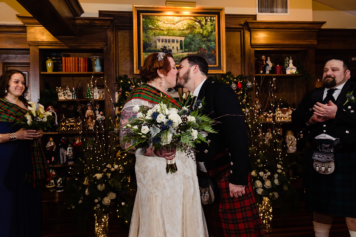 The newly married couple have their first kiss in the Overlook Room in NH