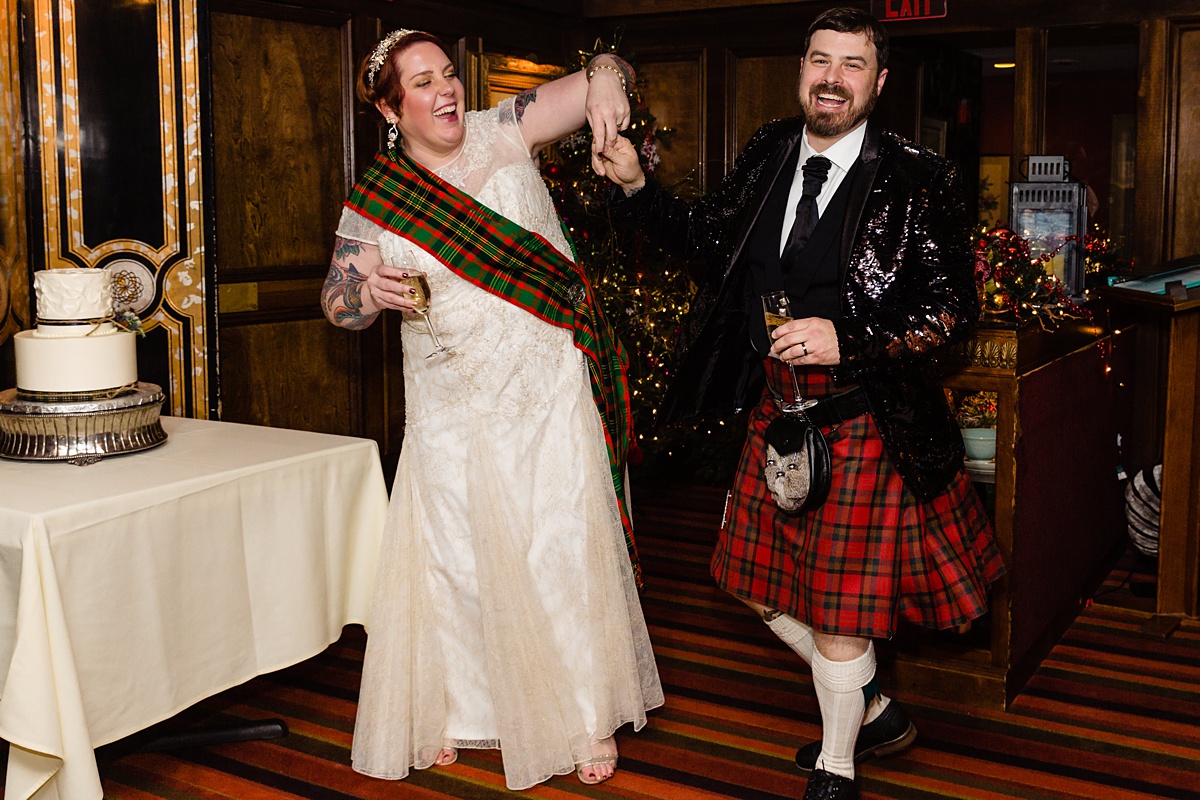 The bride spins the groom in his sequin jacket and kilt as they enter the Overlook Room in Bedford NH