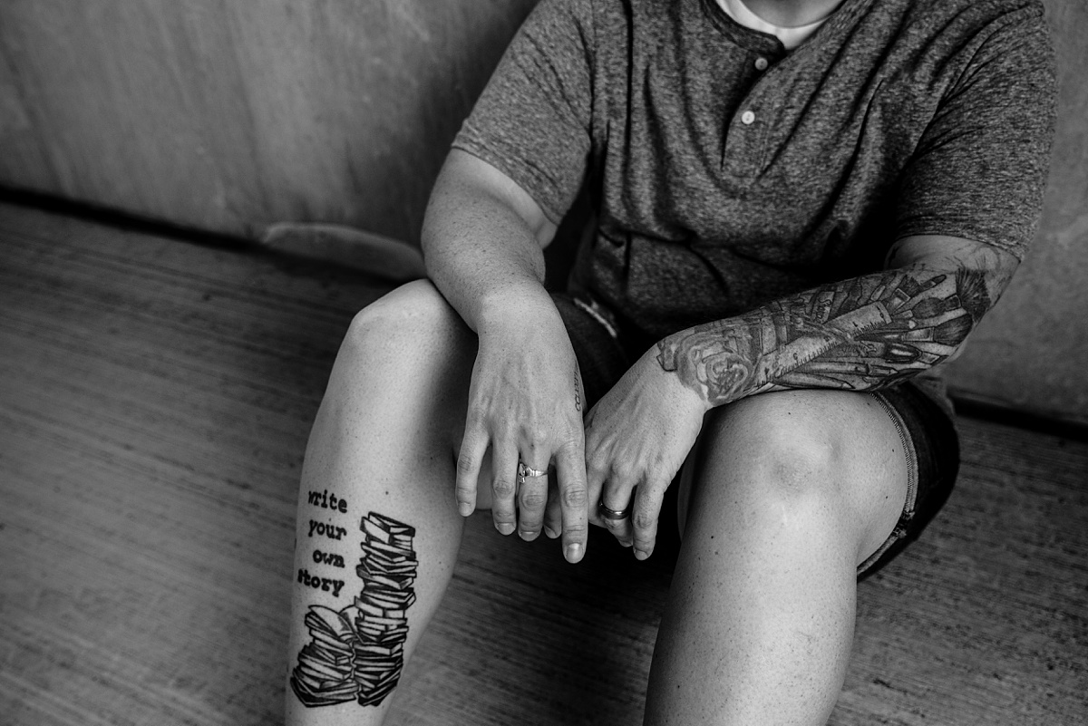 Tattoos and artist hands are photographed in the Seacoast of New Hampshire