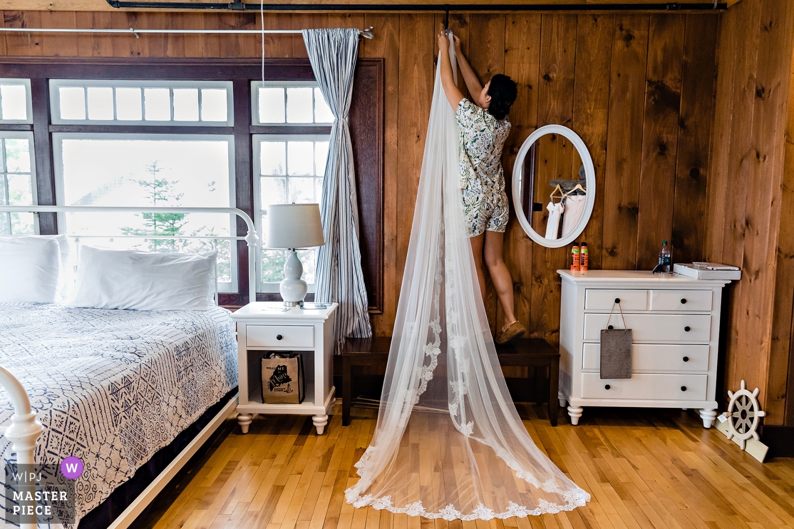 Linekin Bay Resort Wedding Photographer won an award for this Boothbay Harbor celebration where the veil is hung in the cabin to prep for the day.