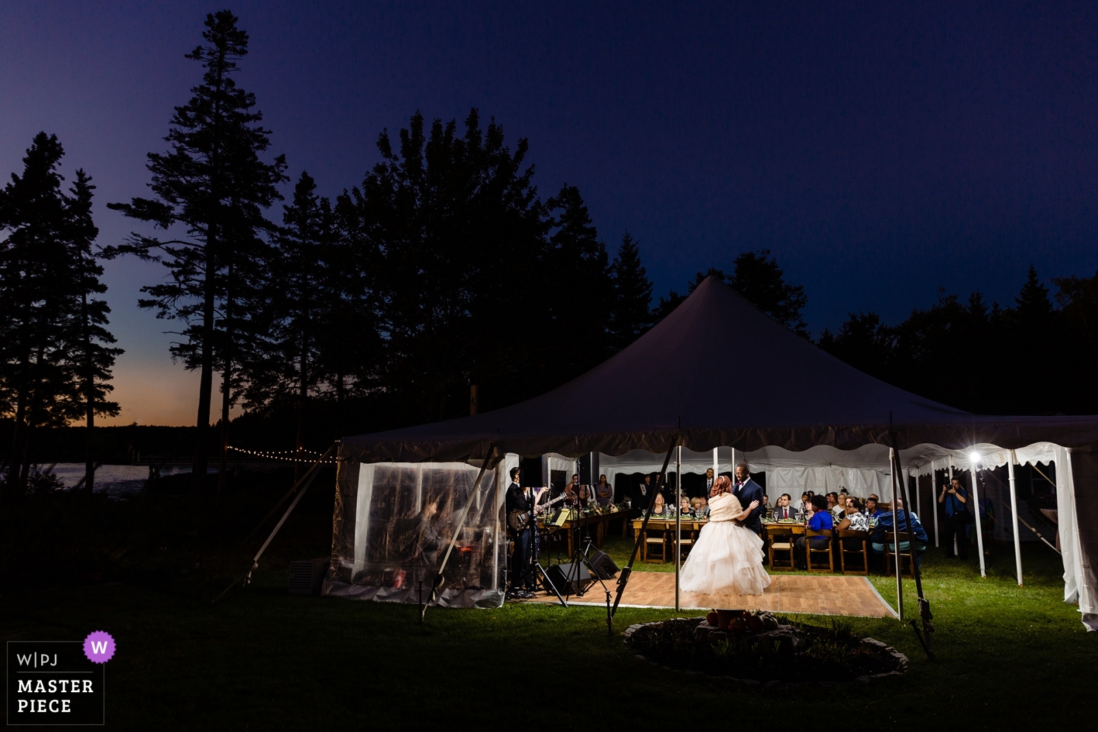 Southport Maine wedding photographer won an award for this tented oceanfront celebration where the couple danced under the sunset sky