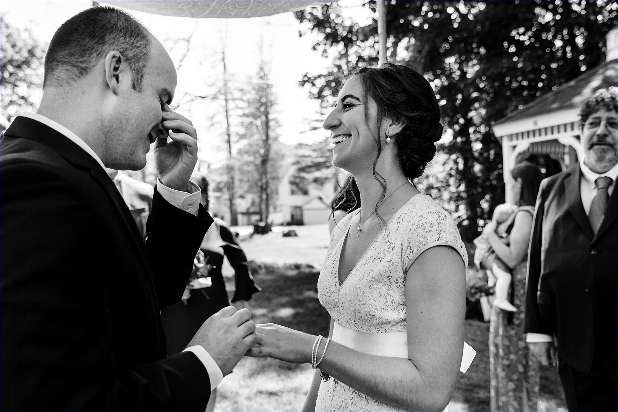 The groom tears up as he places the ring on the bride during their Jackson NH elopement