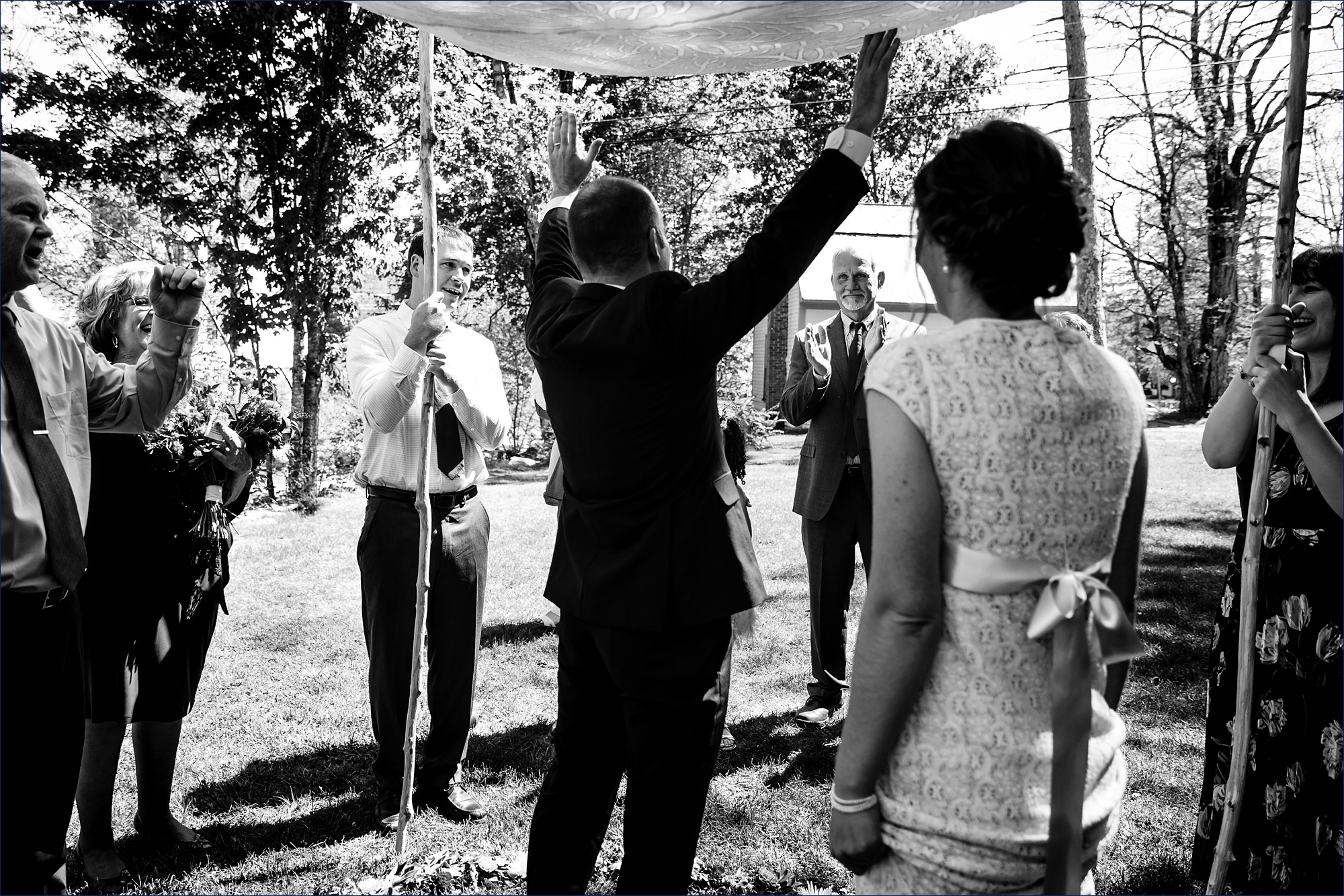 The groom celebrates being officially married to his wife at their Jackson NH wedding ceremony