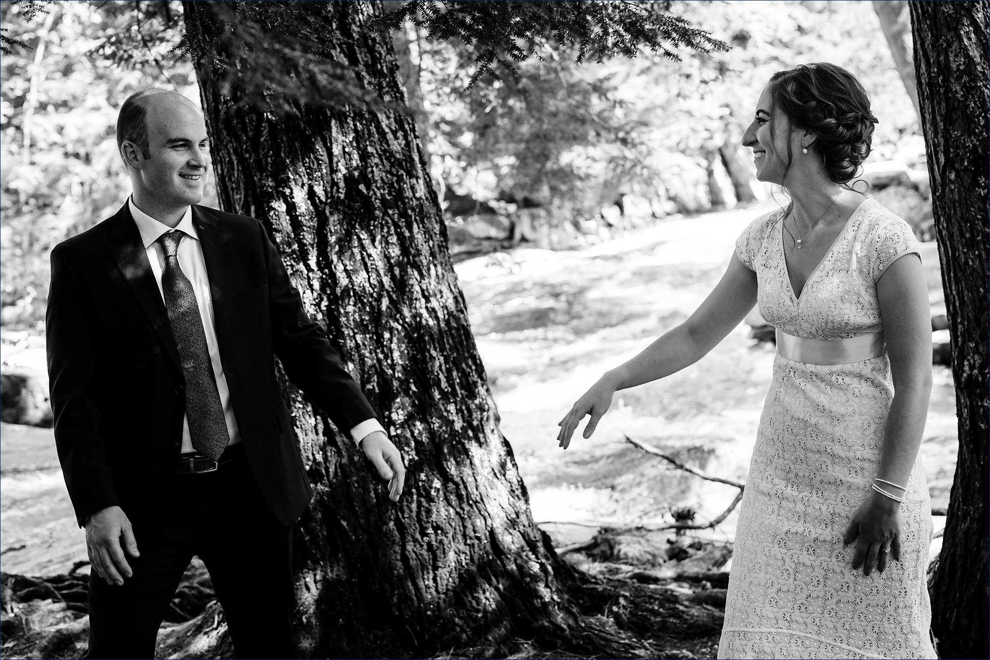 The bride and groom reach for one another in Jackson NH
