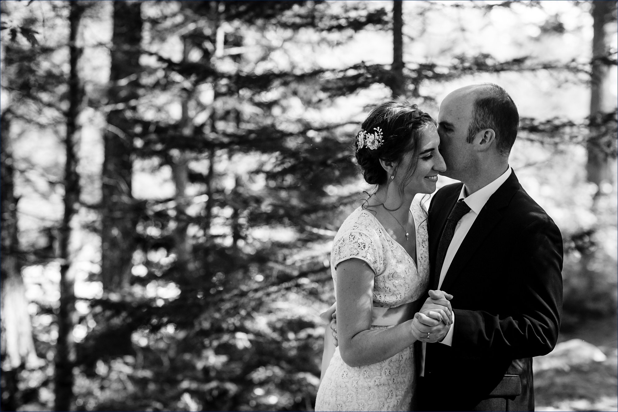 The couple dances in the woods after marrying one another in an intimate elopement in NH