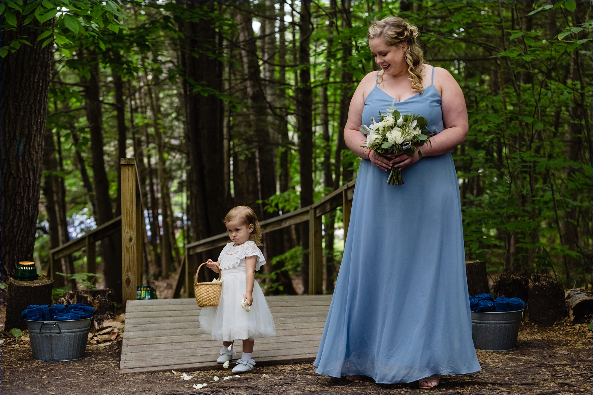 The flower girl enters the wedding ceremony full of sweet attitude at Hardy Farm