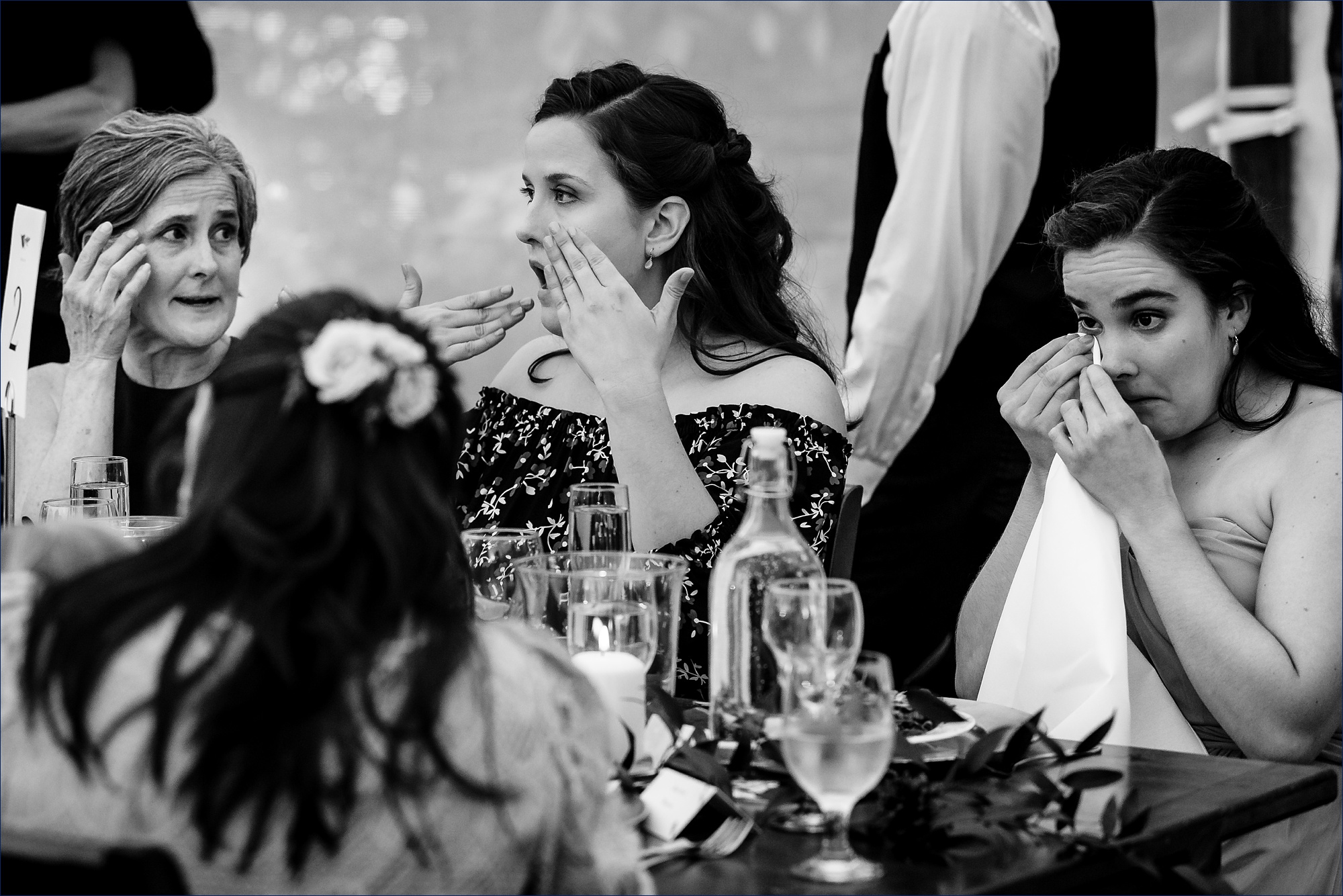 The bridesmaids and the mother of the bride tear up at the toasts during the wedding reception at Hardy Farm in Maine