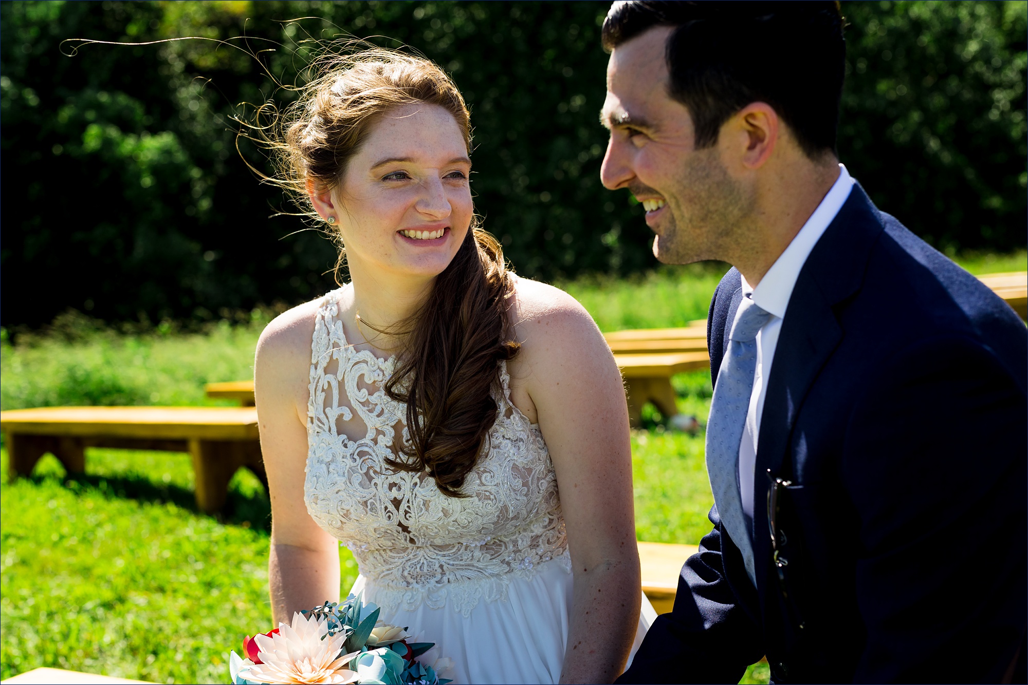 The bride and groom sit together and discuss their wedding day adventure at Kitz Farm 