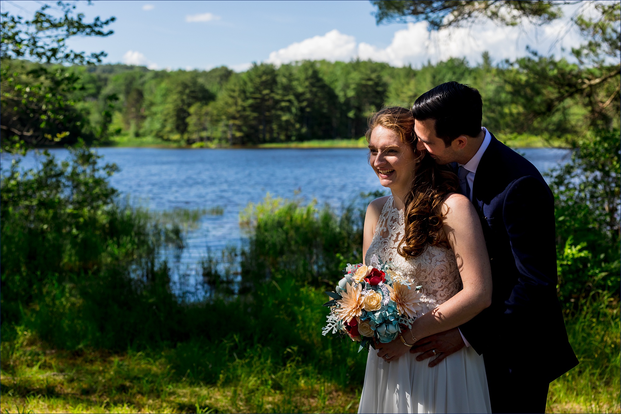 With the water as a backdrop at Kitz Farm, the couple get in close together
