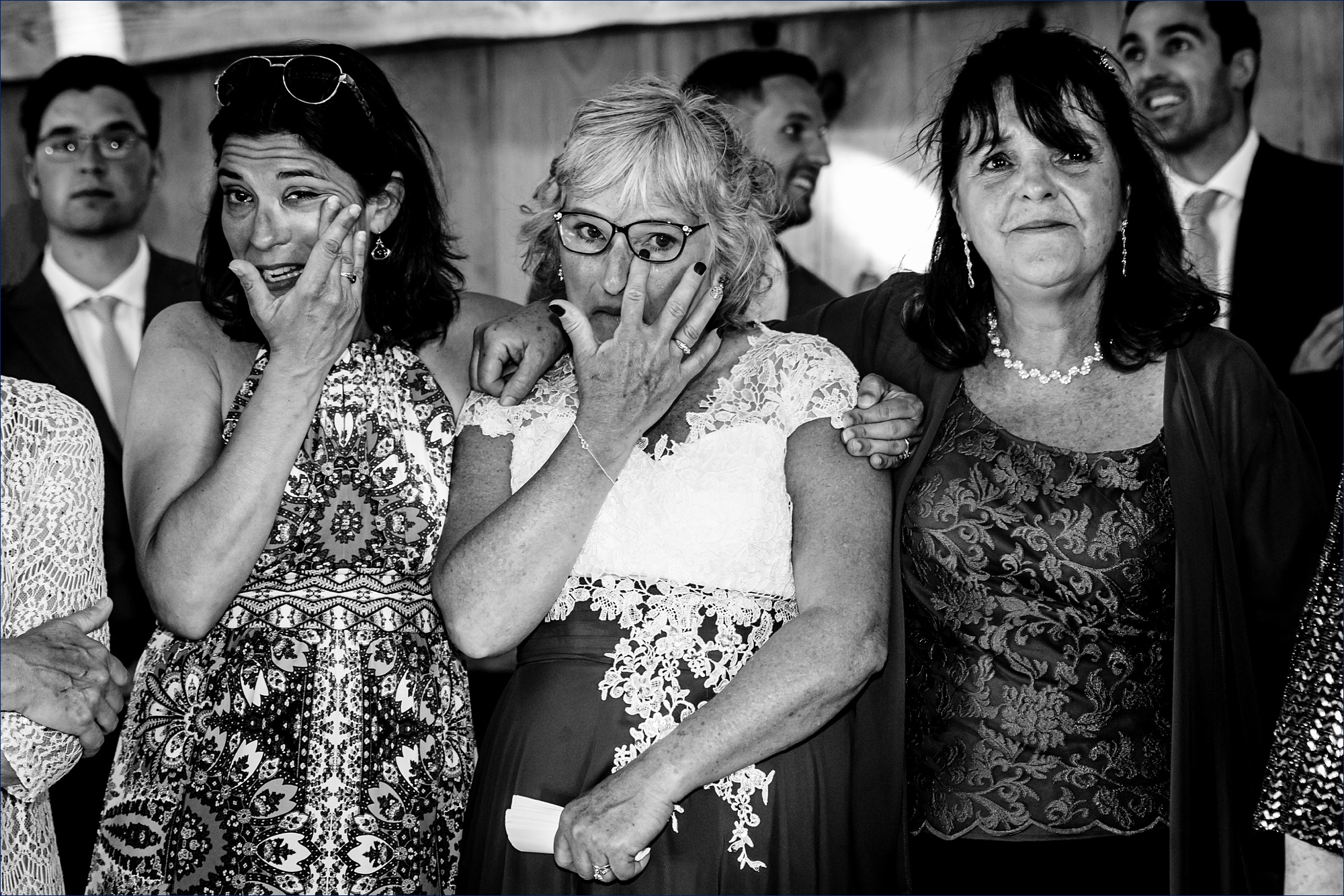 The women close to the bride all tear up as they watch her dance with her father at Kitz Farm