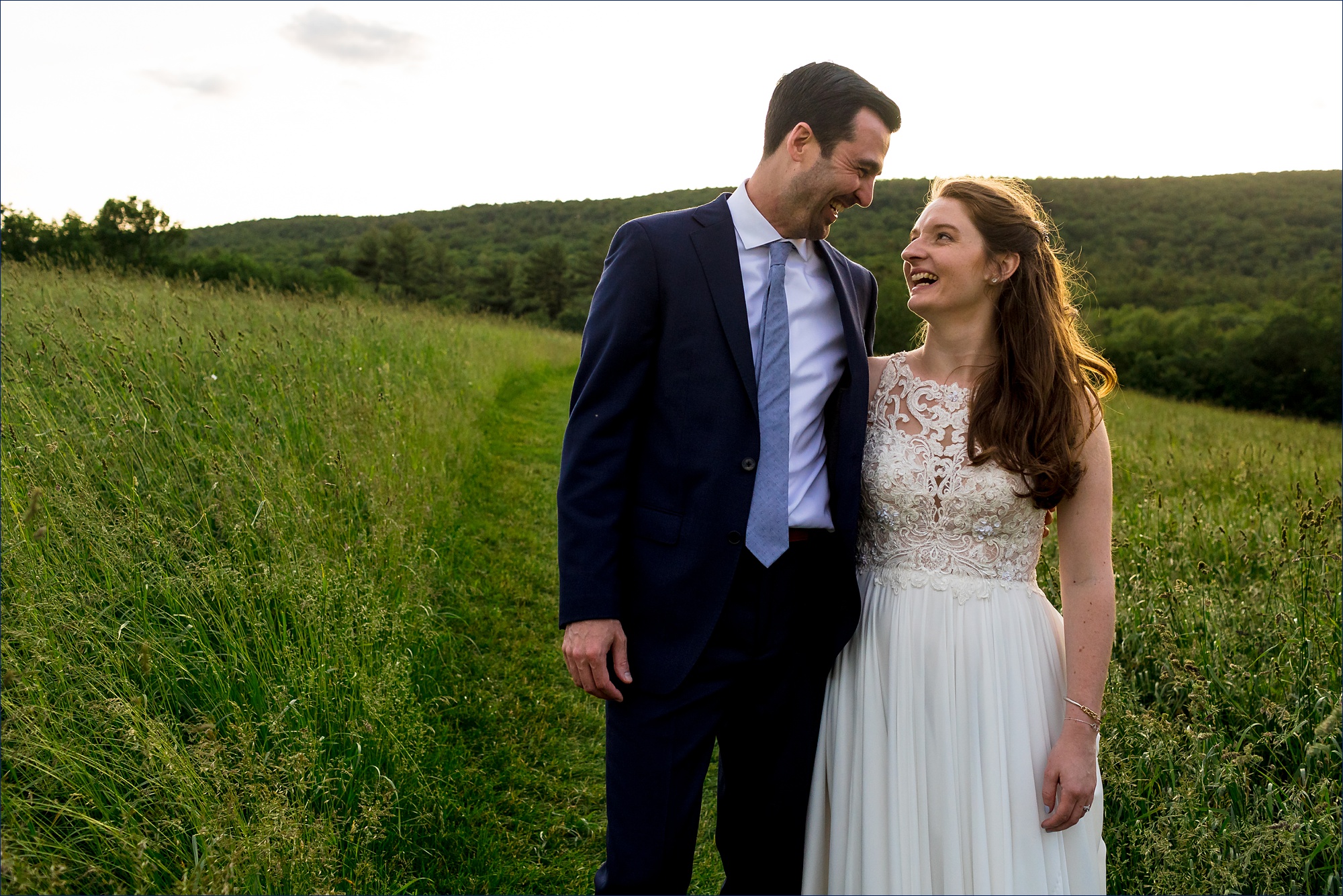 The bride and groom sneak outside in the last light of the day for some photos in the beautiful nature at Kitz Farm in NH
