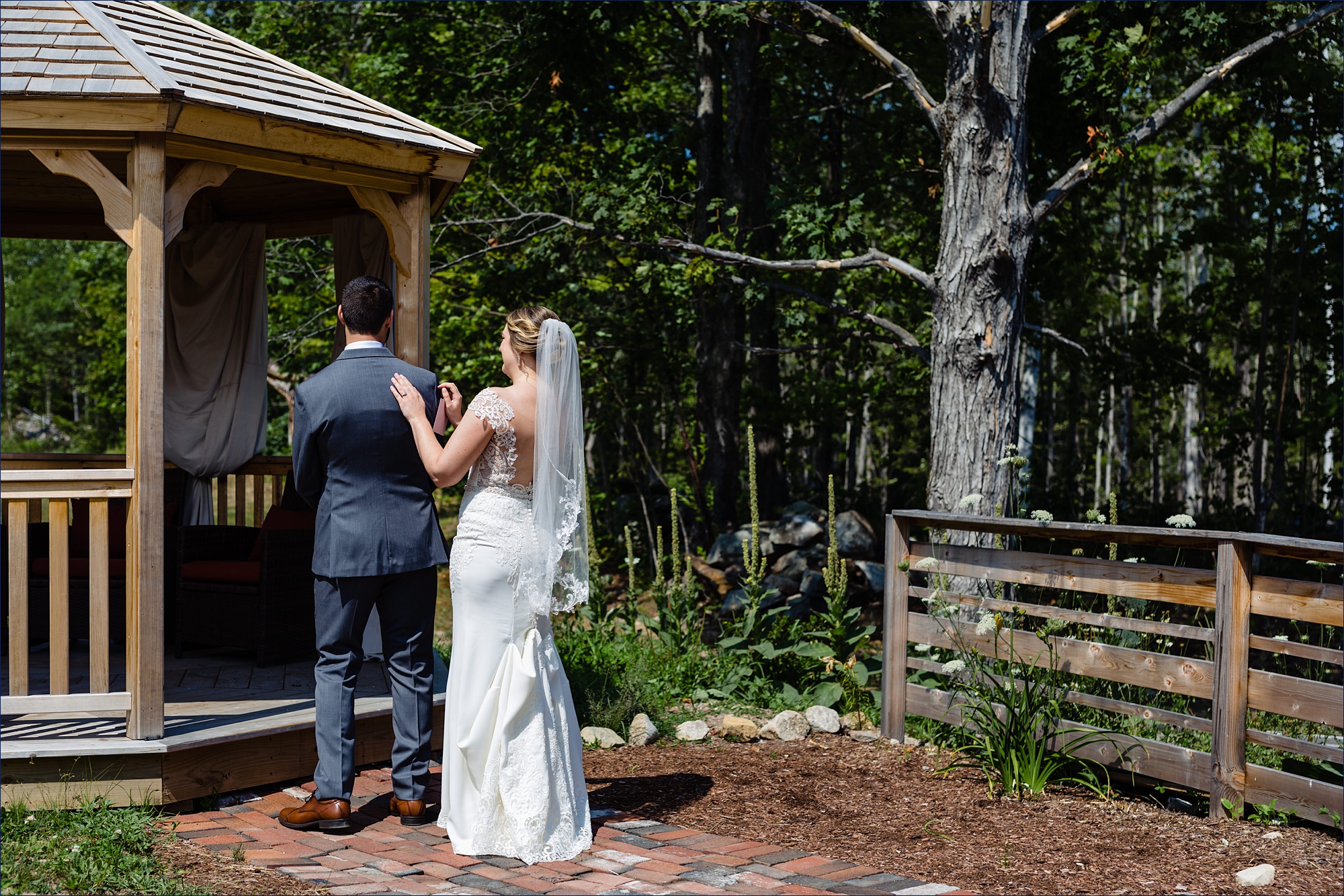 The bride and groom have a first look by the gazebo at The Preserve at Chocorua in Tamworth NH