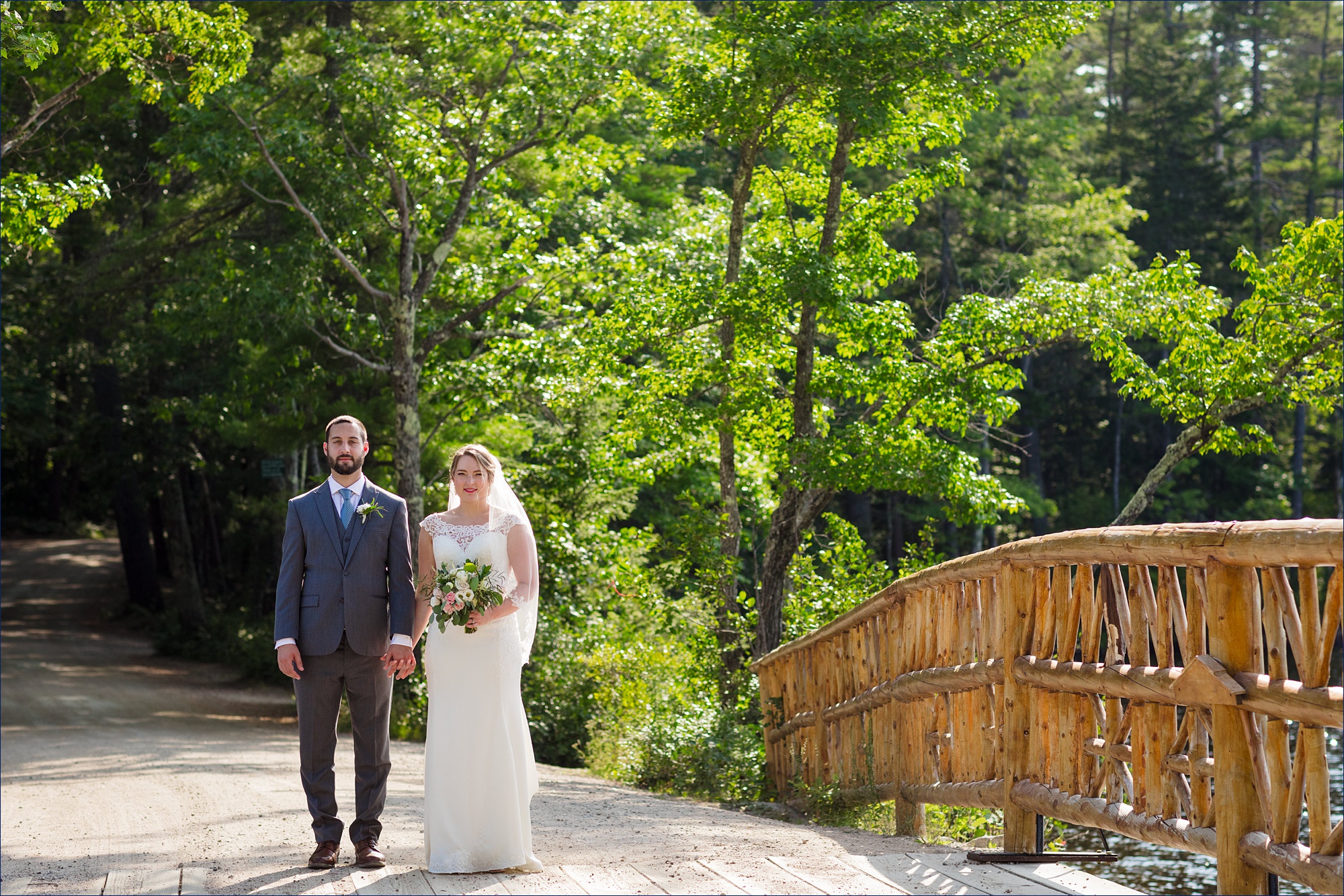 The newlyweds get ready to cross the bridge over Lake Chocorua New Hampshire after their wedding