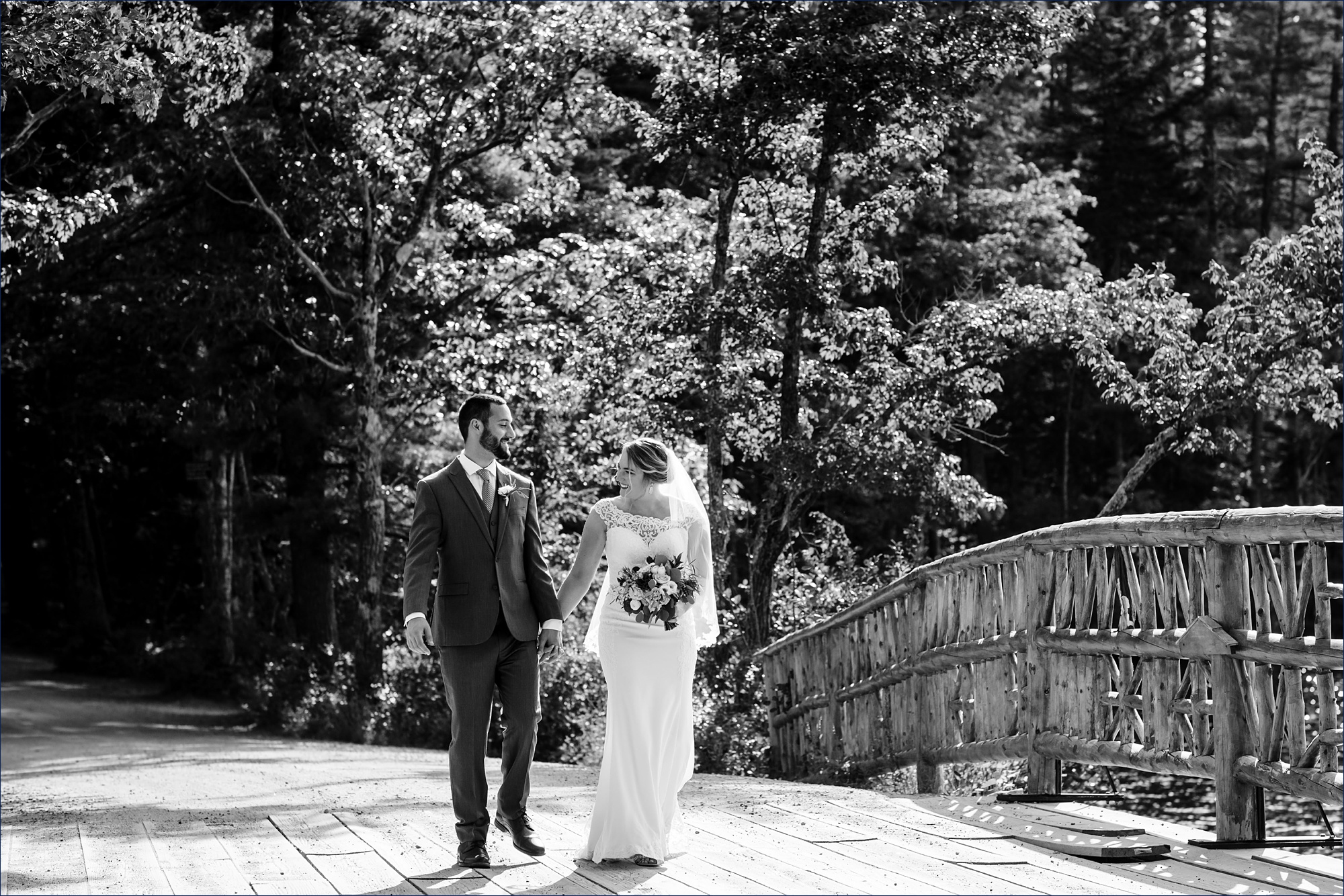 The newlyweds get ready to cross the bridge over Lake Chocorua New Hampshire after their wedding