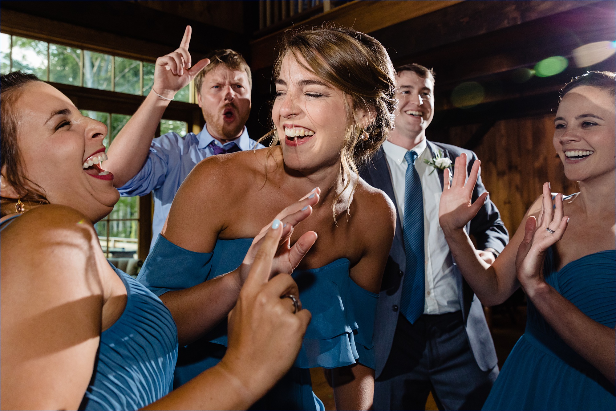Wedding guests dance in the barn for the New Hampshire wedding
