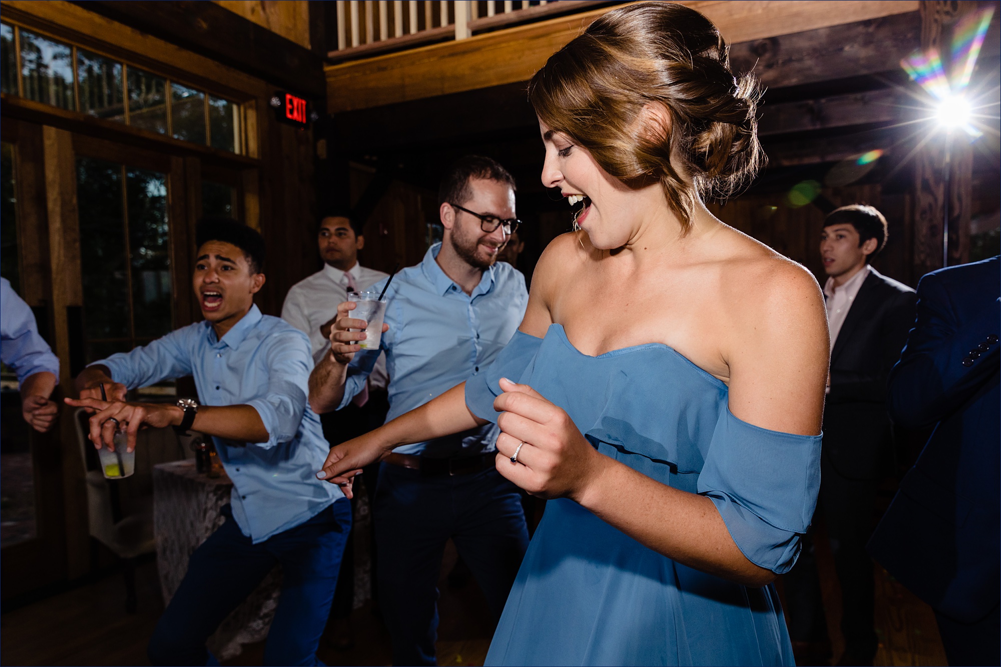 Dancing and singing from the wedding party inside the barn for the NH wedding reception