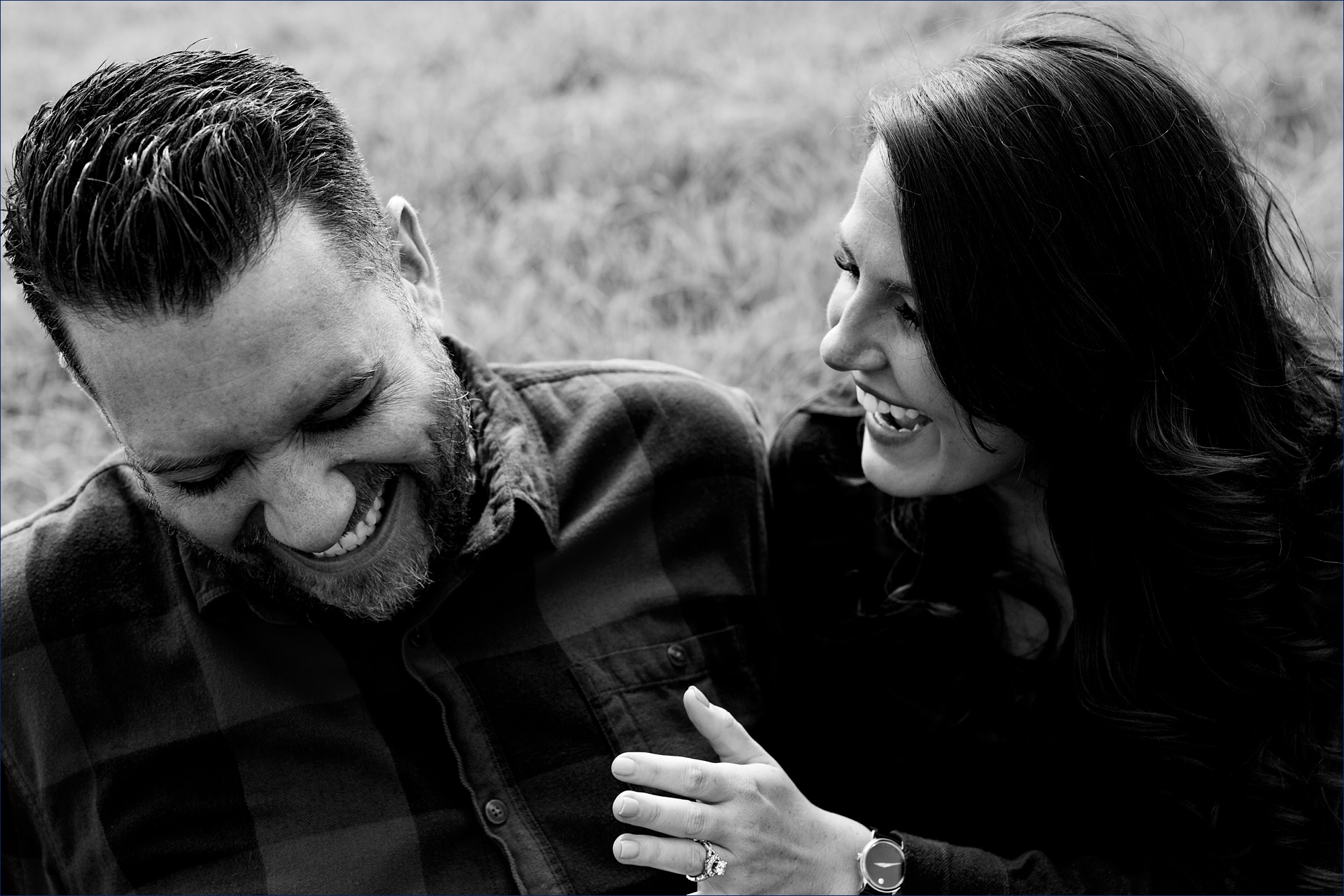 The couple can't stop laughing together while taking their engagement photos in NH