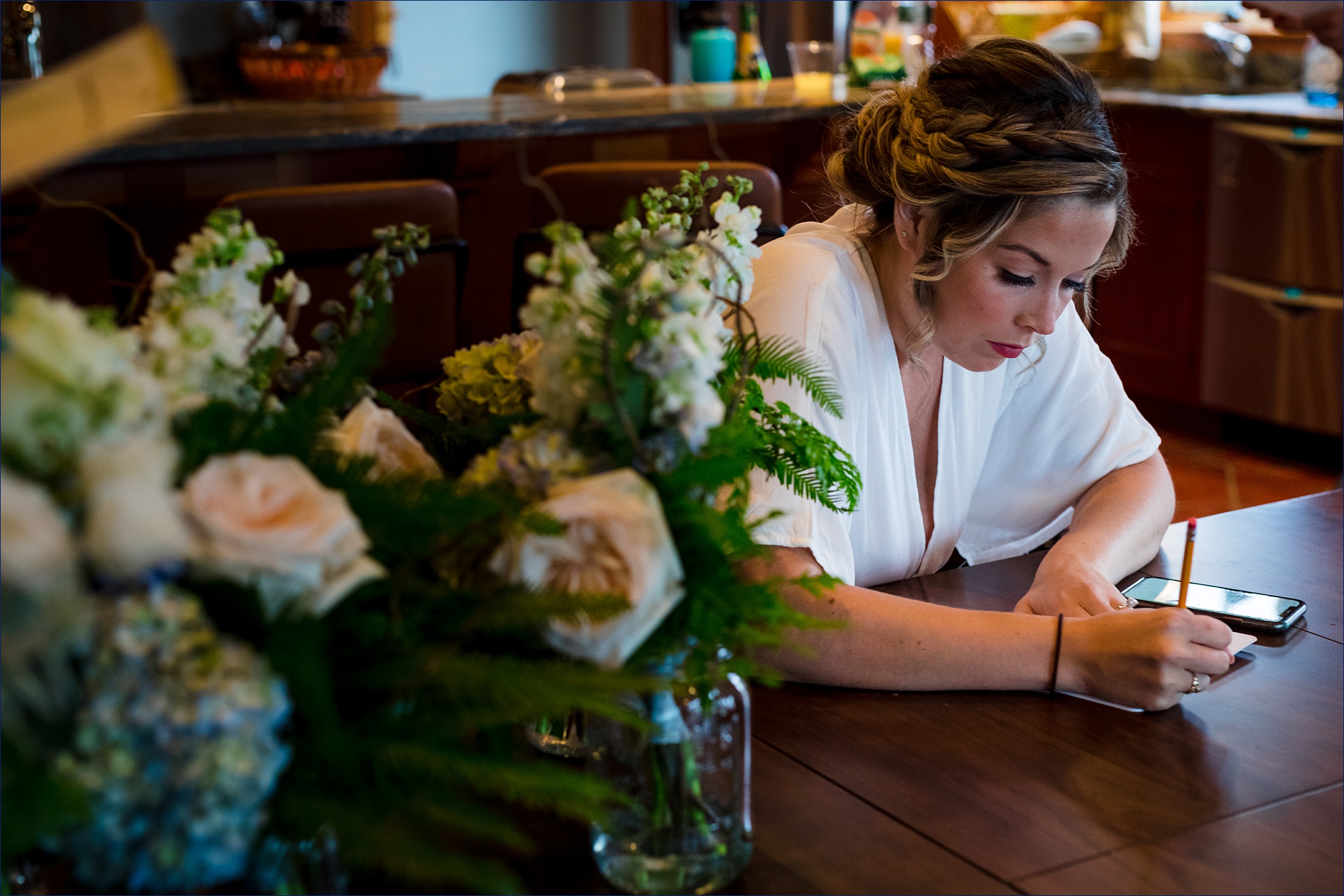 The bride works on her vows a little longer on the day of her Maine wedding