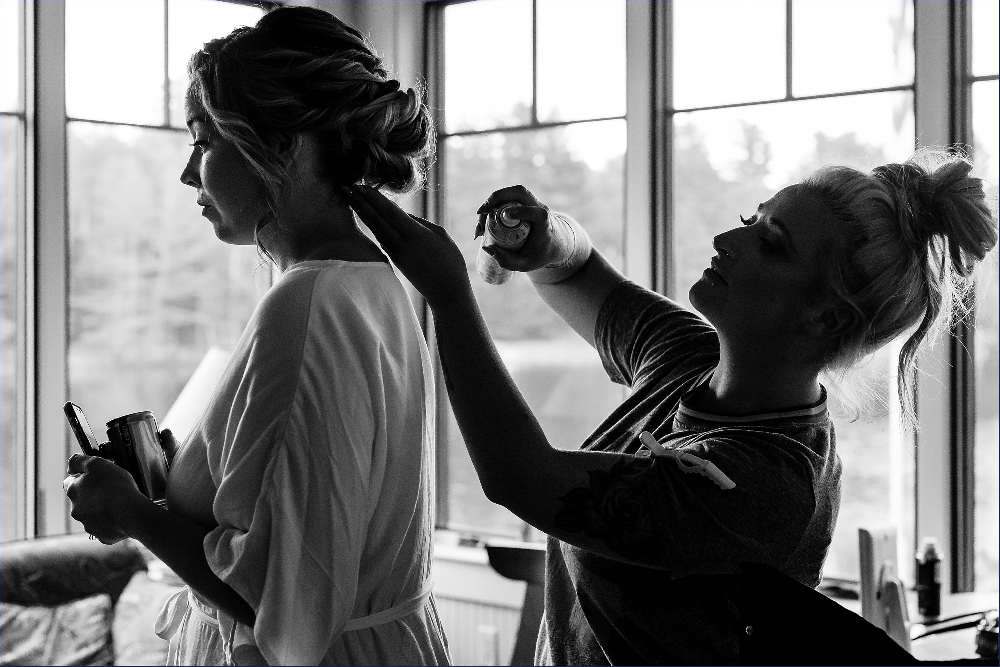 Finishing touches on the bride's hair before she puts on her gown