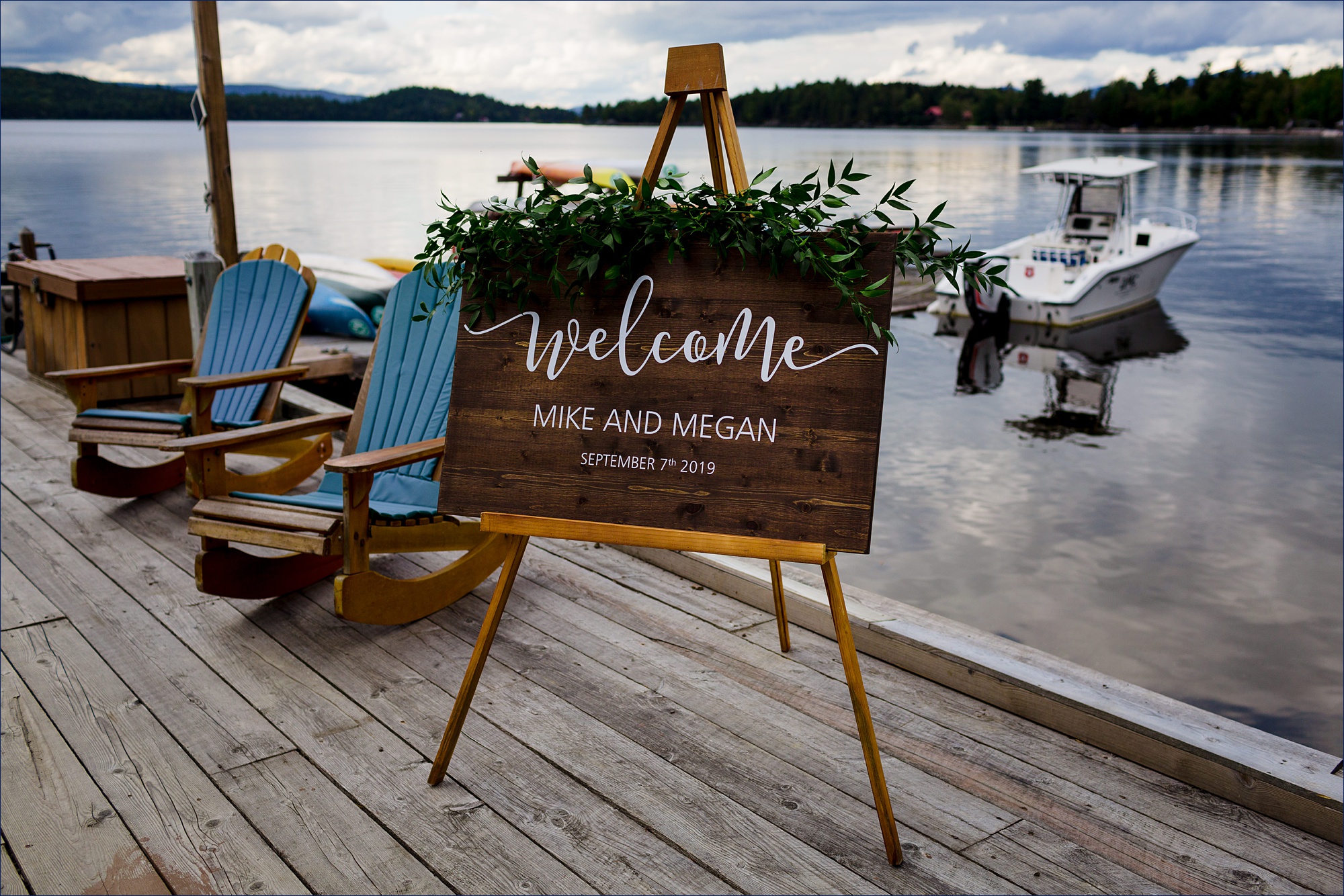 Signs greet guests to the wedding on a dock
