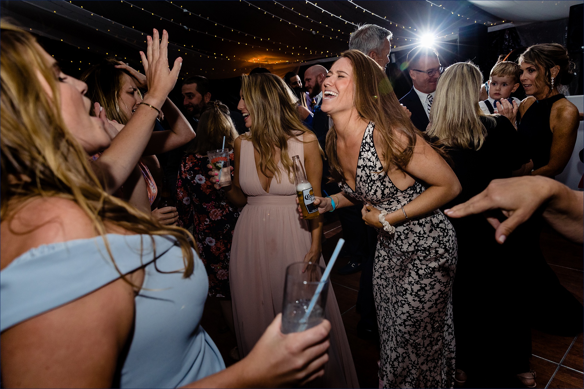 Guests get the party rolling on the dance floor at the wedding reception