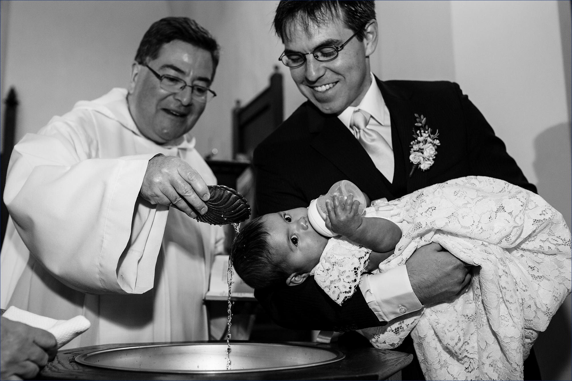 The newlyweds have their daughter baptized as part of their wedding ceremony in Dartmouth New Hampshire