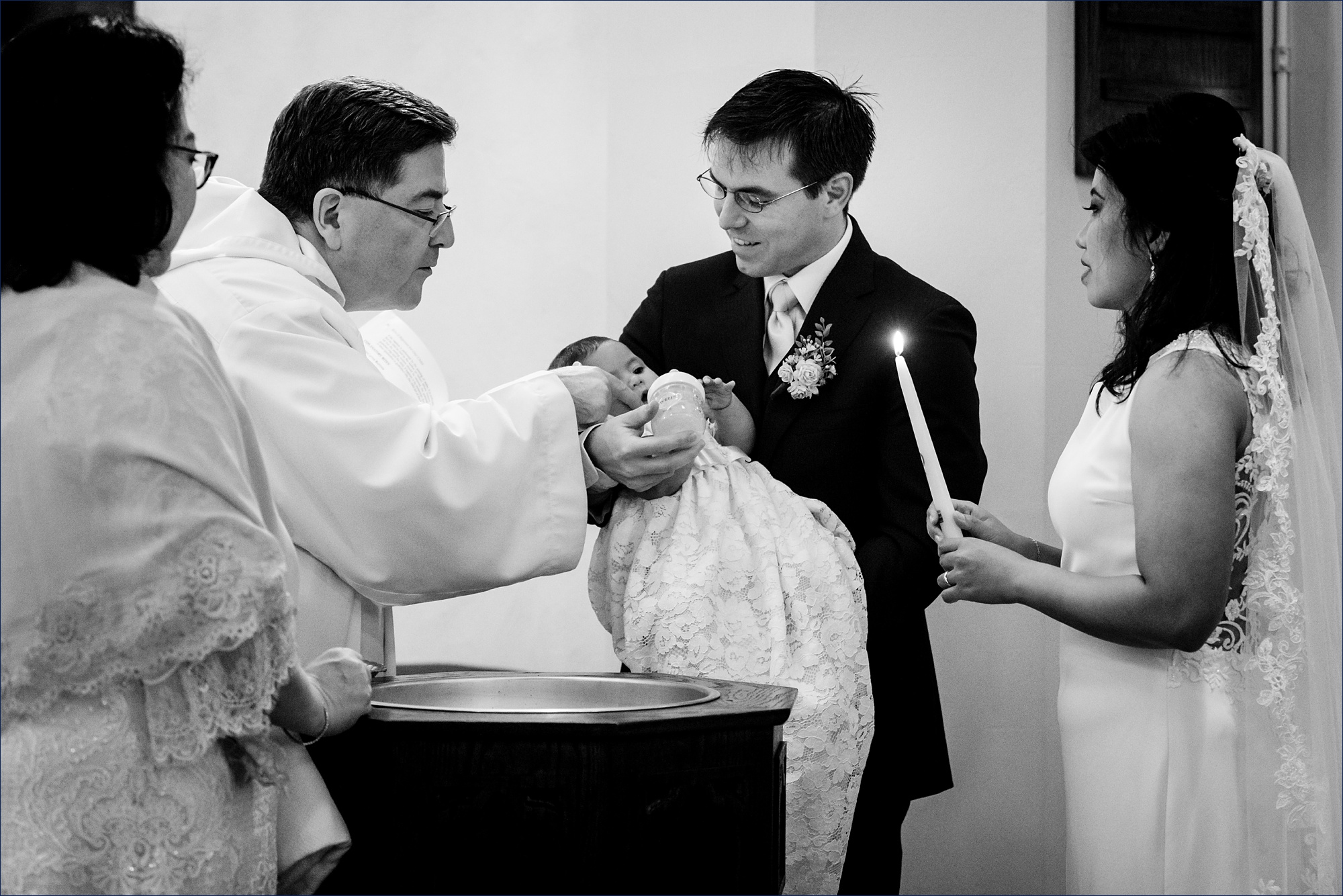 The newlyweds have their daughter baptized as part of their elopement ceremony in New Hampshire