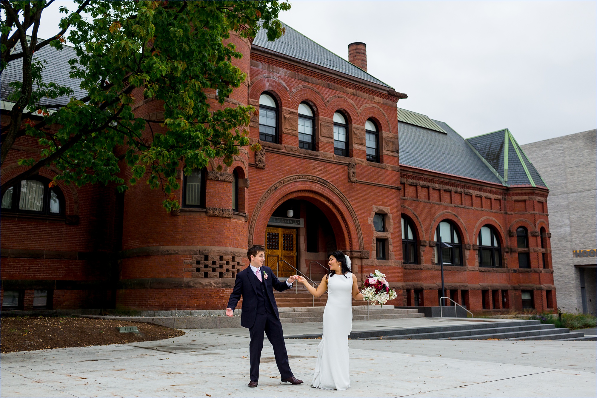 The bride and groom dance with one another after eloping on the Dartmouth NH campus