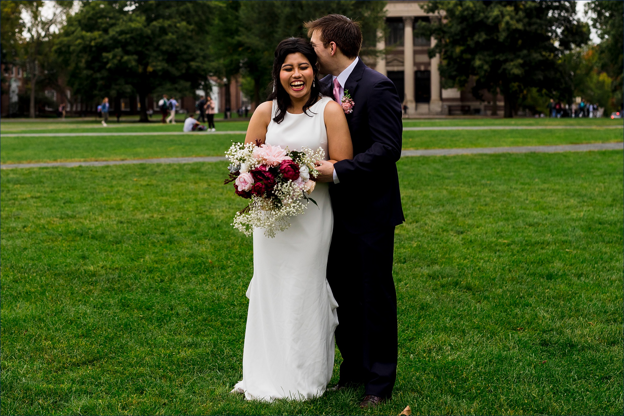 The couple share a laugh together on The Green in Dartmouth after their fall wedding