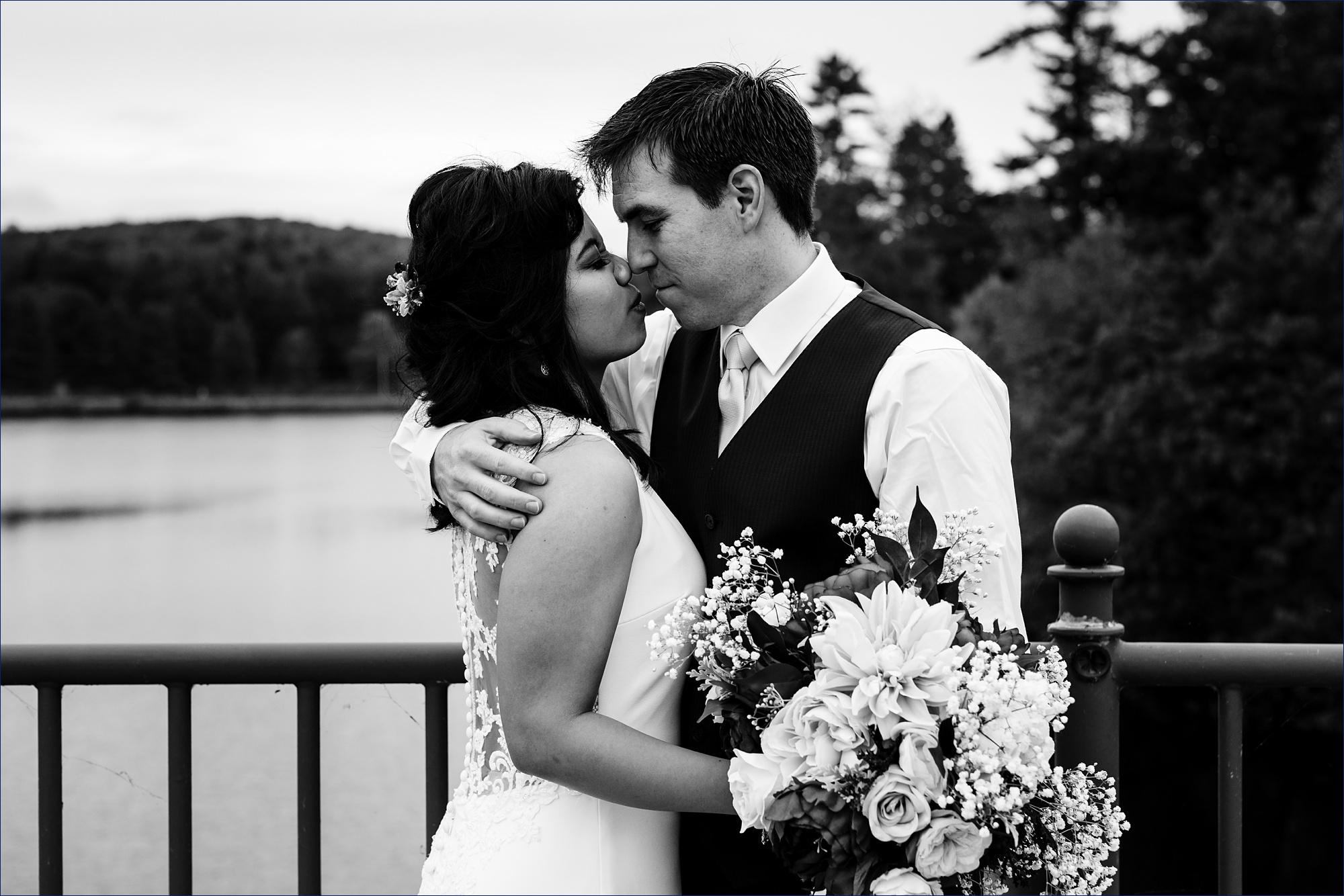 Face smushing and kisses on a scenic bridge after their Dartmouth NH elopement